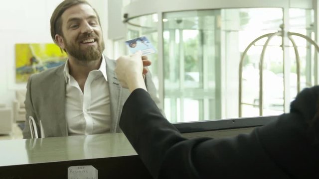 Businessman checking into hotel