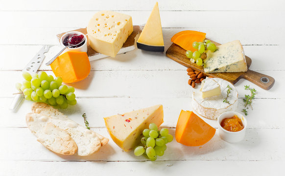 Different types of Cheeses served with grapes