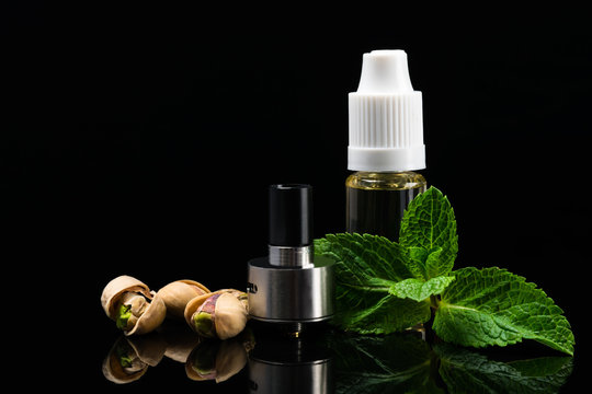 Concept of nut and mint flavors for electronic cigarettes on a black background