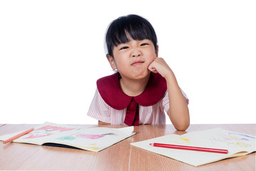 Asian Little Chinese girl drawing with color pencils