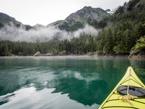 Kayaking in Alaskan Cove in Humpy Cove, Resurrection Bay near Seward, Alaska, USA