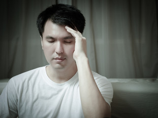 portrait of asian handsome man worry and sleepless all night in bedroom