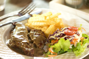 Freshly grilled steak and French Fries