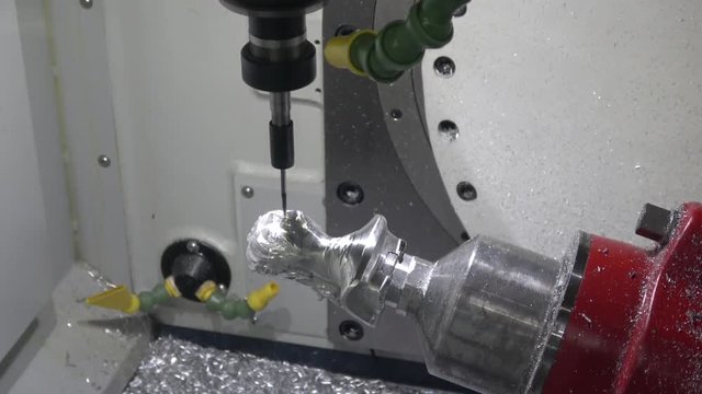 Full 5-axis Spinner machine. Close up of metal processing
