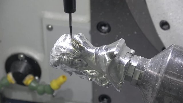 Full 5-axis Spinner machine. Close up of metal processing