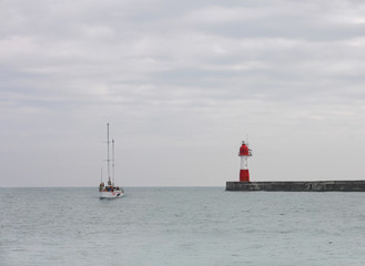 Fototapeta na wymiar Red beacon at sea