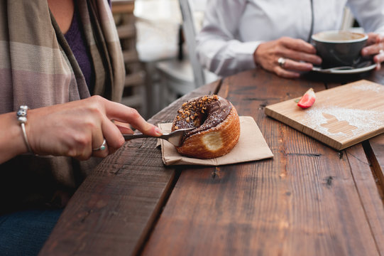 woman eating cronut