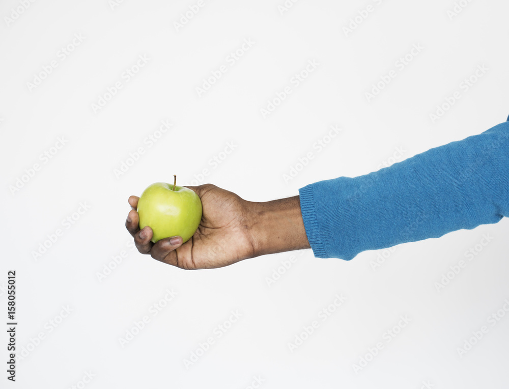 Wall mural male person holding apple concept - Wall murals