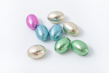 Multi-colored easter chocolate eggs in colored foil
