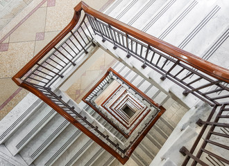 Spiral stairwell winding down inside office block