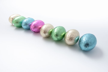 Multi-colored easter chocolate eggs in colored foil