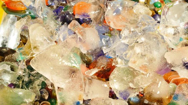 Melting ice opening view to a treasure with precious stones