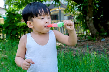 Asian Little boy eating  Ice-Cream.Close up