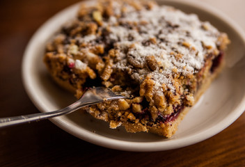 A bite of apple crumble in a cafe