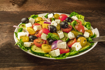 Greek salad with feta, fresh vegetables, and copyspace
