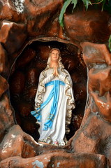 Blessed Virgin May, Mother of God in grotto 