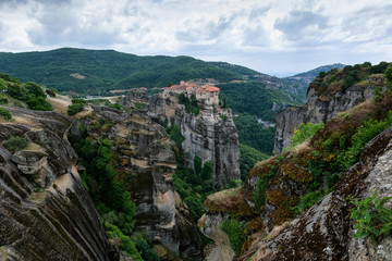 Fototapeta na wymiar Beautiful scenic view of Meteora monasteries built on natural conglomerate pillars, at the northwestern edge of the Plain of Thessaly near the Pineios river and Pindus Mountains, Greece.