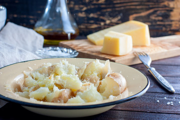 Mashed boiled potatoes with cheese and butter