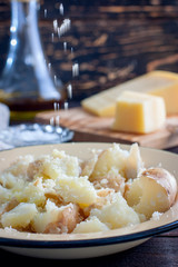 Mashed boiled potatoes with cheese and butter