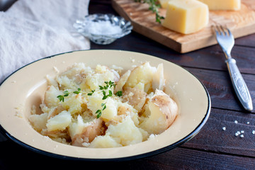 Mashed boiled potatoes with cheese and butter