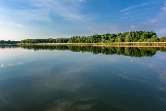 French countryside. Lake Lac de Madine in the Parc Naturel Regional de Lorraine in the early morning after sunrise.