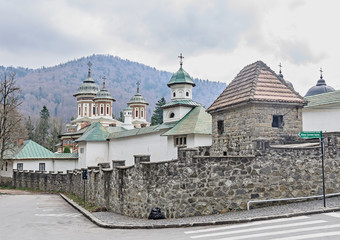 The orthodox Monastery Sinaia with towers and crosses on top, outdoor details close up