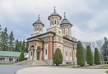The orthodox Monastery Sinaia with towers and crosses on top, outdoor details close up