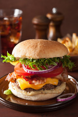 bacon cheese burger with beef patty, tomato and onion