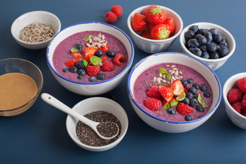 healthy berry smoothie bowl with strawberry blueberry raspberry and chia seed