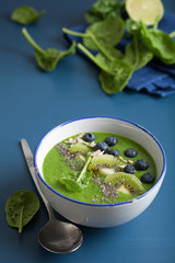 green smoothie bowl spinach kiwi blueberry banana with chia seed