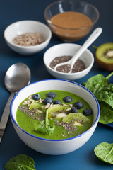 green smoothie bowl spinach kiwi blueberry banana with chia seed