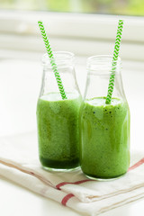 healthy green spinach smoothie with cilantro lime banana ginger