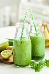 healthy green spinach smoothie with cilantro lime banana ginger