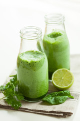 healthy green spinach smoothie with cilantro lime banana ginger