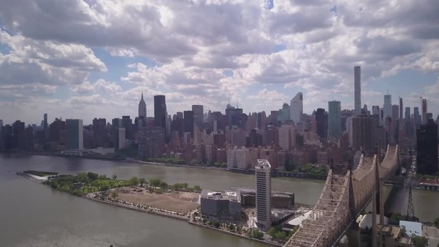 view of Manhattan descending to reveal Queensboro Bridge