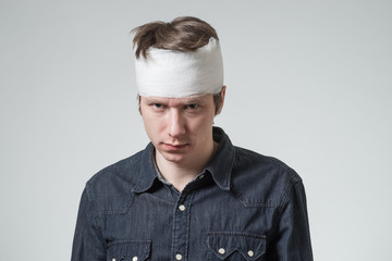 Man with bandage on his head