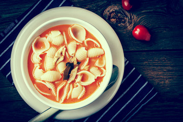 Fresh tomato soup with conchigliette. Instagram style filtred image.