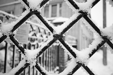 steel grate covered with snow background