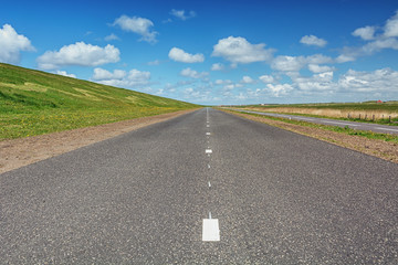 The road along The Hondsbossche Zeewering which is a 5.5 km long dike near Petten in The Netherlands