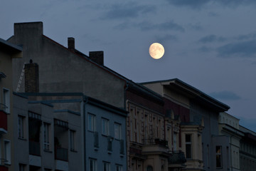 full moon of city residential houses