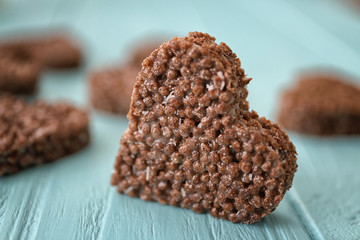 Heart shaped crispy dessert on wooden background