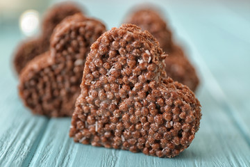 Heart shaped crispy dessert on wooden background