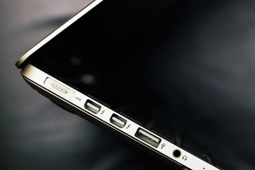 Power connector, USB and headphones ports