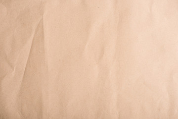 Close-up top view of old brown crumpled paper texture