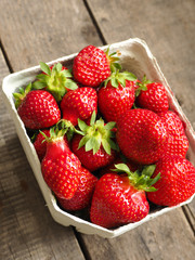 Fresh organic strawberries on wood