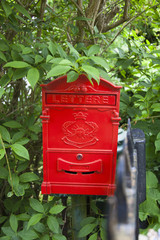 Nostalgic red mailbox in a garden 