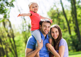 Fototapeta premium Young Family With Daughter 