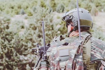 Radio operator aim target with machine gun m 249