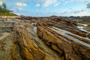 Beach with rocks, waves stream in Terengganu, Malaysia