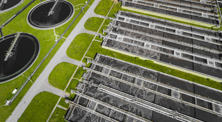 Sewage farm. Static aerial photo looking down onto the clarifying tanks and green grass. Geometric...